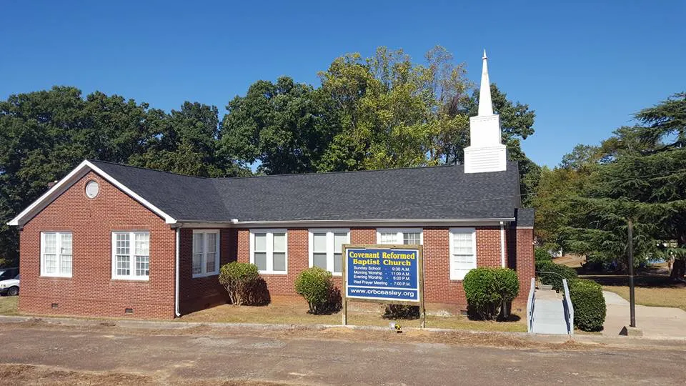 Covenant Reformed Baptist Church, a red-brick building with a white steeple, on Arial Street in Easley