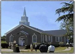 Church members gathered outside the church building